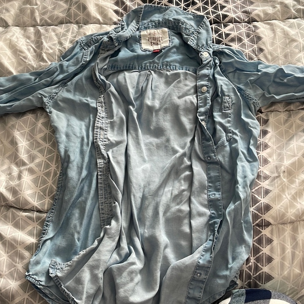 A thin button up long sleeve. can be worn with a shirt underneath or without.